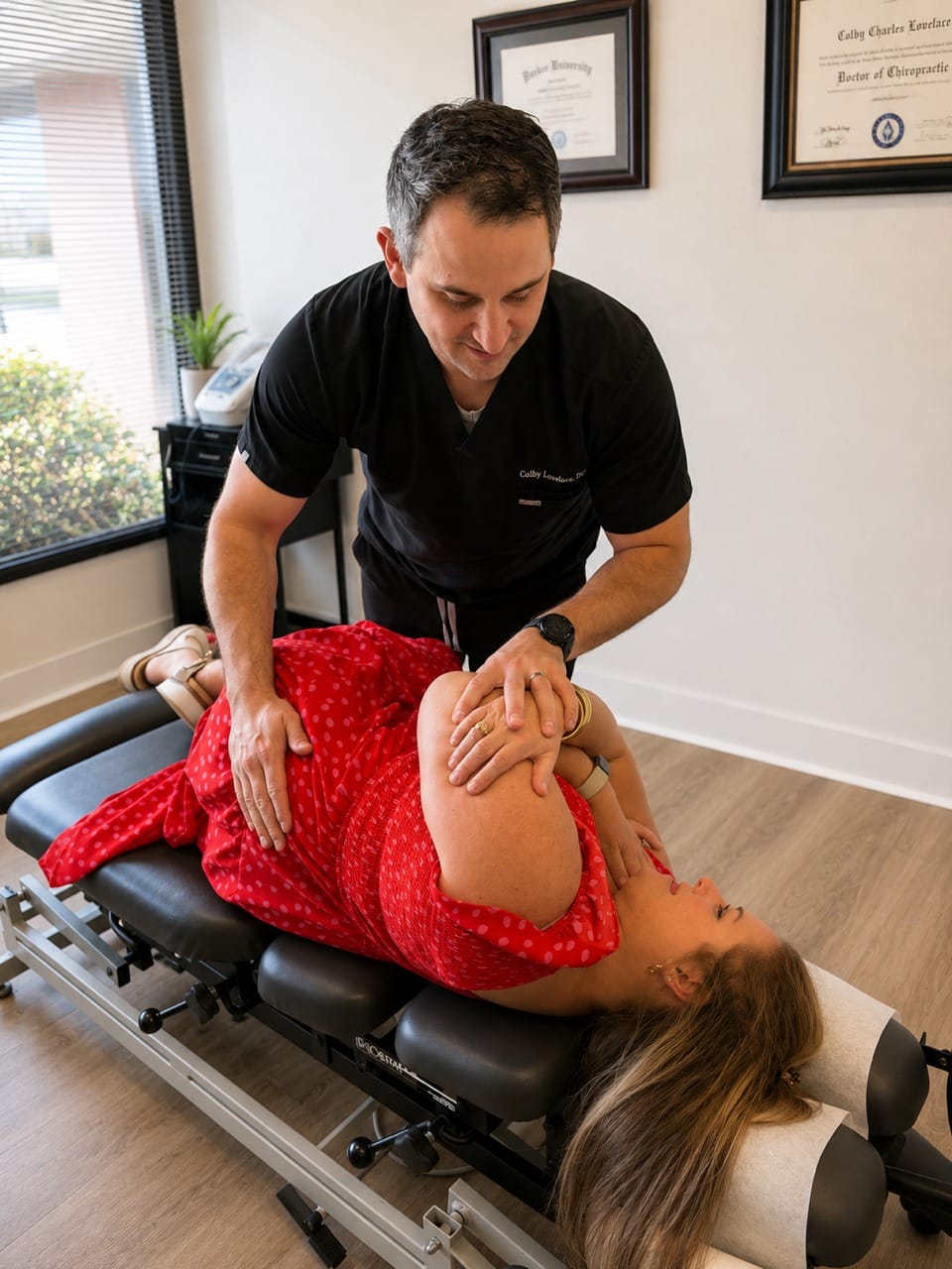 Dr. Lovelace performing a chiropractic adjustment on a patient